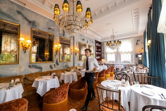Gigi's salon-like interior features chandeliers.