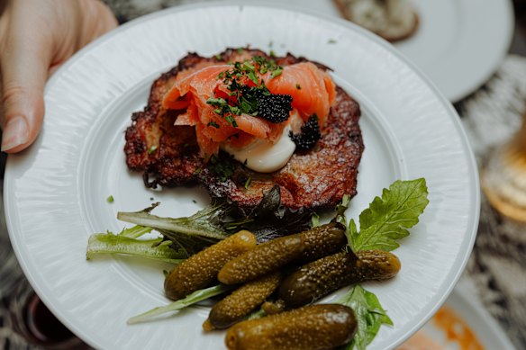 Fried potato pancake with smoked salmon, caviar and sour cream.