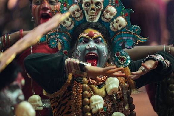 An artist dressed as Hindu goddess Mahakali performs during Ganesh Chaturthi celebrations in Hyderabad, India.