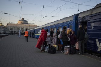 People embark on a train in Odesa. More than 4 million people have left Ukraine during the war.