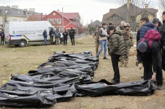 Ukrainian Prosecutor General Iryna Venediktova looks at exhumed bodies of civilians killed during the Russian occupation in Bucha, on the outskirts of Kyiv.