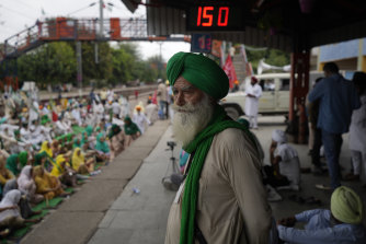 A Sikh farmer stands as farmers protesting against contentious agriculture laws sit on railway tracks to block trains for six hours in Bahadur Garh on the outskirts of New Delhi, India, last month. 