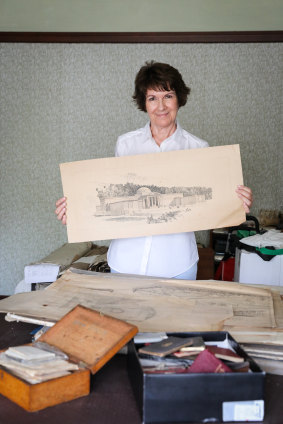 Lucy King with the collection of old architecture plans belonging to her grandfather, John Crust, who was one of the architects of the Australian War Memorial. 