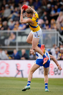 Young Eagle Harley Reid takes a hanger over North’s Aidan Corr in Hobart.