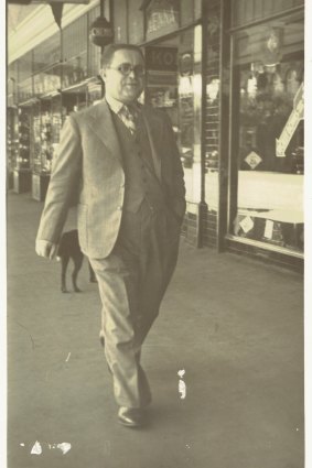 Abraham "Jack" Rudov strides proudly along Dean Street, Albury, close to his store, Rudov Modes.