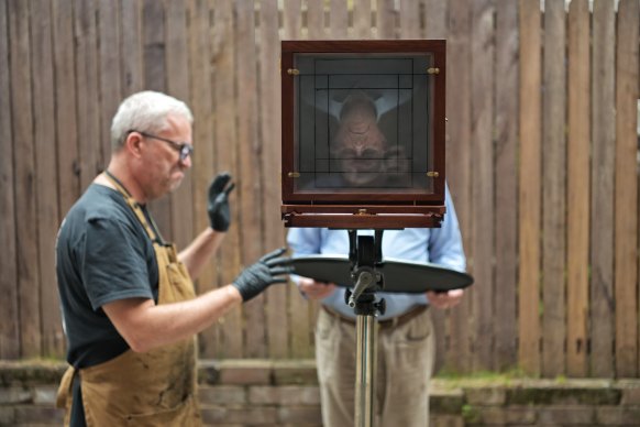 Jack McLain (left) uses wet plate photography to capture long-lasting images of veterans, including Rod White.
