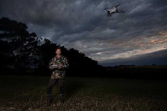 Brenny Florance, a feral animal control officer, uses a drone and thermal technology to detect feral cats.