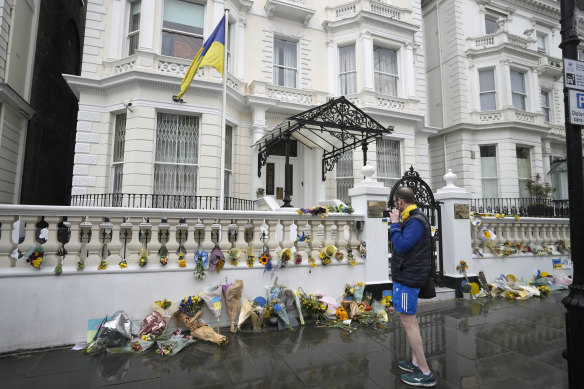 Flowers laid by protesters against the war in Ukraine outside the Ukrainian embassy in London.