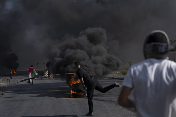 Palestinian demonstrators clash with Israeli forces following a demonstration in support of the Gaza Strip, in the West Bank city of Ramallah.