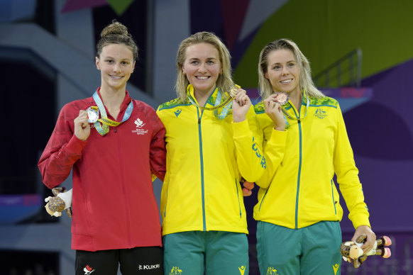 Summer McIntosh, Ariarne Titmus and Kiah Melverton receive their medals after the womens’ 400m final at the Commonwealth Games.