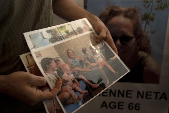 Nahal Neta, son of Adrienne Neta, 66, holds a photo of the nurse living in Kibbitz Be’eri missing since a Hamas surprise attack on the Gaza border