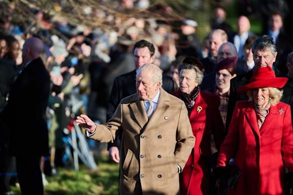 King Charles and Queen Camilla wave to the public at Sandringham Estate on Christmas Day.