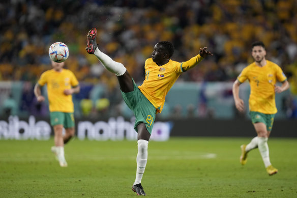 Garang Kuol reaches for the ball during the World Cup group D soccer match between France and Australia in Qatar.