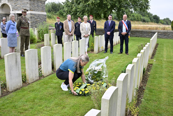 The Australian Olympic team’s deputy chef de mission Kaarle McCulloch places a wreath on the grave of Cecil Healy in Assevillers, northern France. 