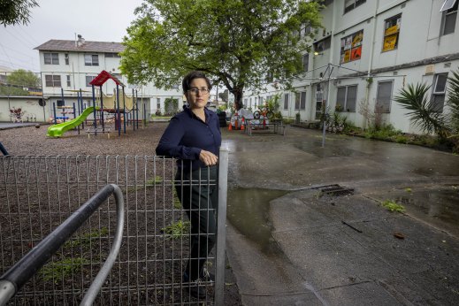 Greens candidate Gabrielle de Vietri at the estate. To one side is the playground, and to the other is the area beneath the building that filled with raw sewage.