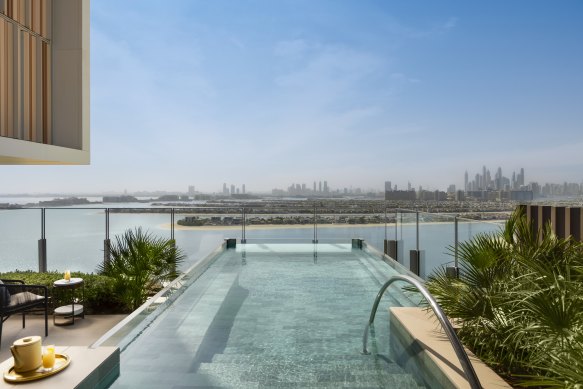 Pool villa suites overlook the fronds of the Palm Jumeirah.