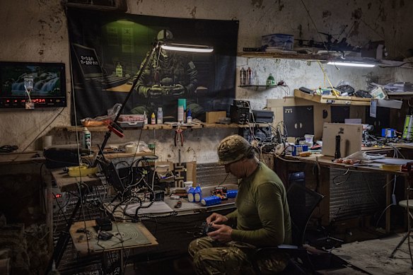 A soldier works at a field drone storage facility in Sumy, Ukraine. 