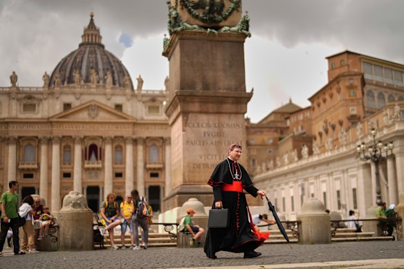 Cardinal Francis Leo walks along St Peters Square at the Vatican on Monday.