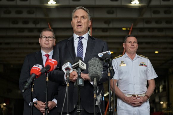 Defence Minster Richard Marles (centre), with Defence Industries Minister Pat Conroy (left) and Chief of the Navy Mark Hammond in Sydney.