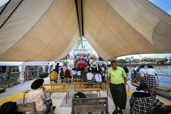 Hundreds of local high school students go through the ship on its open day at Suva’s port in Fiji. 