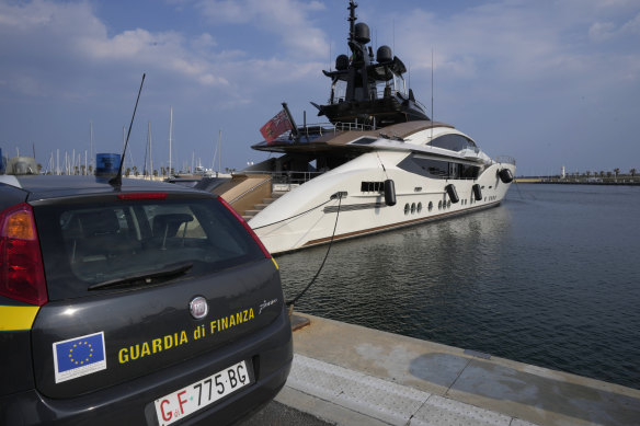 An Italian police car parked in front of Russian oligarch Alexei Mordashov’s yacht Lady M. 