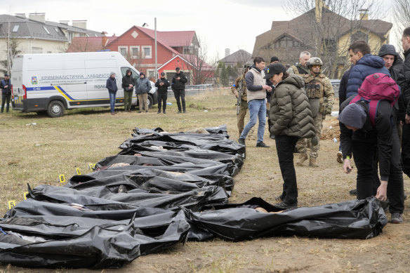 Ukrainian Prosecutor General Iryna Venediktova looks at exhumed bodies of civilians killed during the Russian occupation in Bucha, on the outskirts of Kyiv.