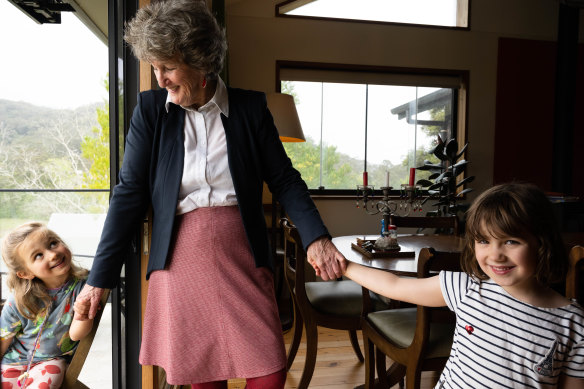 Lyndall Parris, the founder of the Narara Ecovillage, with her grandchildren, Clementine, left, and Clara, right, on the Central Coast of NSW.