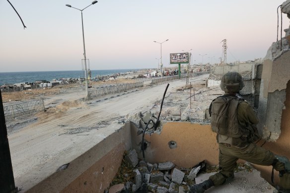 Israeli military personnel holding a position within sight of the Gaza coast.