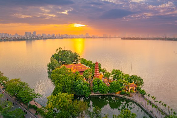 The sun sets over Hanoi’s Tran Quoc Pagoda, one the city’s oldest temples built atop an island on the Vietnamese capital’s West Lake.