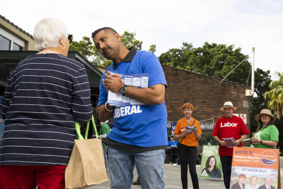 Singh greets voters at Mona Vale Community Centre on Tuesday.