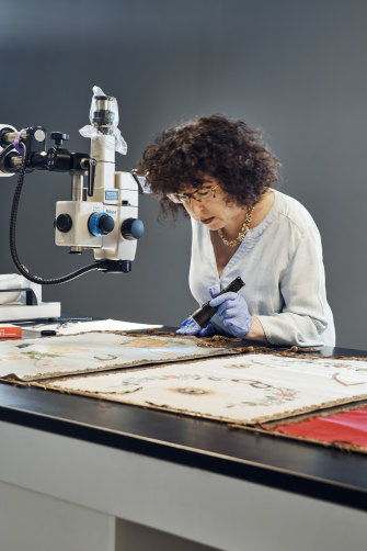 Jennifer Mass examines some old paint; the work of her Scientific Analysis of Fine Art lab is in increasing demand from the art world.