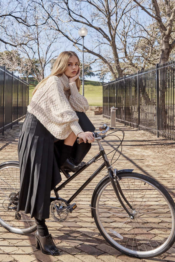 Zimmermann “In Illustration” sweater, $850. Courtney Zheng “Ansel” skirt, $540. Max Mara shoes, $1600 (worn throughout). H&M socks, $20 (worn throughout).