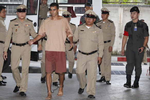Hakeem Al-Araibi arrives at the Bangkok court on Monday with his legs shackled.