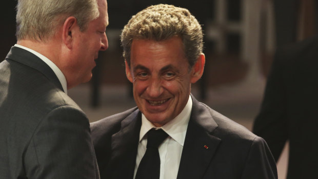 Former French president Nicolas Sarkozy speaking with former US vice-president Al Gore in Dubai earlier this week. 