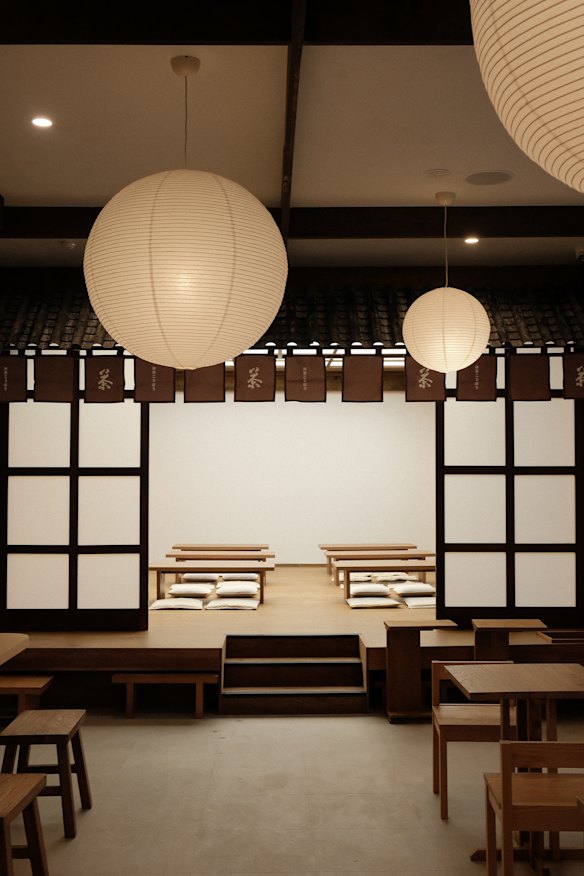 Inside the cafe, including a cushioned floor seating area.