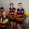 Jordan Dawson of the Crows leads the team out.