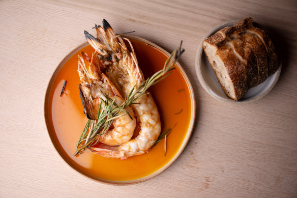 Wood-fired prawns with lardo and paprika oil.