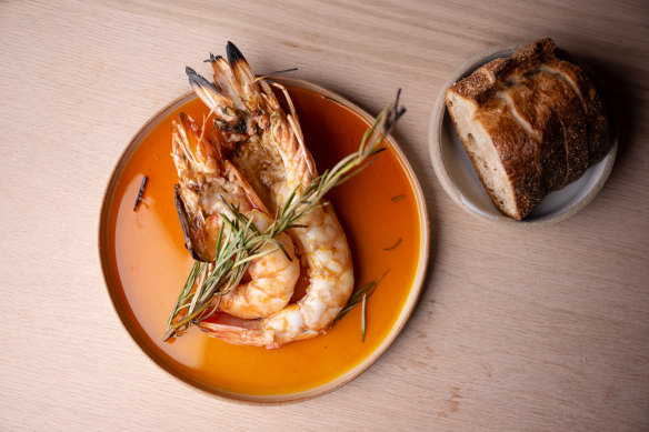Wood-fired prawns with lardo and paprika oil.