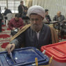 Iranian voters at the ballot on March 1.