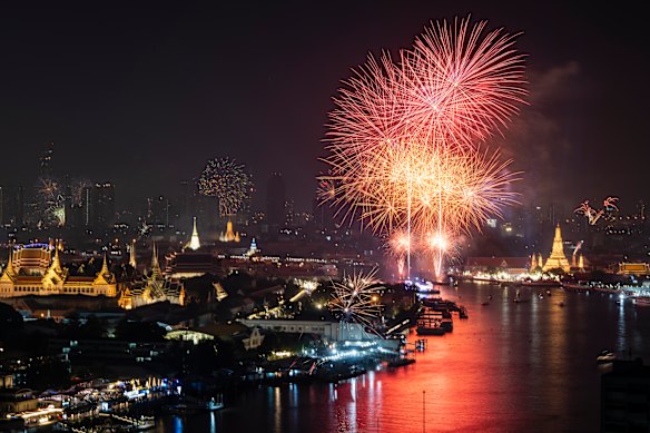 Fireworks explode over the Chaoprayah River during the new year celebration in Bangkok, Thailand.