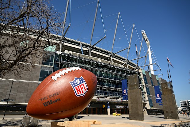 MELBOURNE, AUSTRALIA - SEPTEMBER 08: A giant NFL Football is seen outside the MCG at the Melbourne Cricket Ground on September 08, 2026 in Melbourne, Australia. (Photo by Quinn Rooney/Getty Images)
