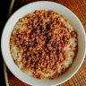 Toasted coconut adds crunch to Toby Wilson’s signature Anzac porridge.