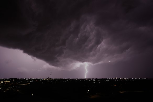 Lightning flashes as a thunderstorm passes in the distance Monday, April 13, 2026, in Lenexa, Kansas. 
