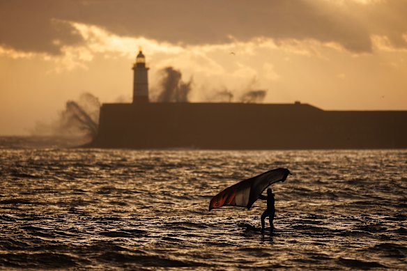 A foil boarder makes the most of the windy condition in Newhaven, England.