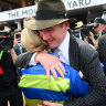 Jamie Kah is hugged by trainer Ciaron Maher.