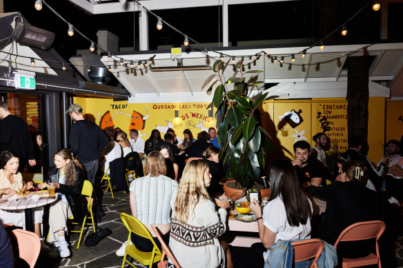 The colourful courtyard by night.