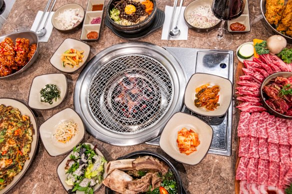 Banchan (side dishes) surround the grill at Yori.
