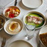 Assorted meze including zucchini kefte and tzatziki.