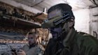 Ukrainian soldiers control FPV drones to fire towards Russian positions in a shelter in the Donetsk region.