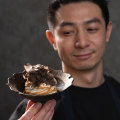 Koi Dessert Bar owner-chef Reynold Poernomo with his truffle and tonka bean caramel soft serve at Monkey’s Corner, Chippendale.